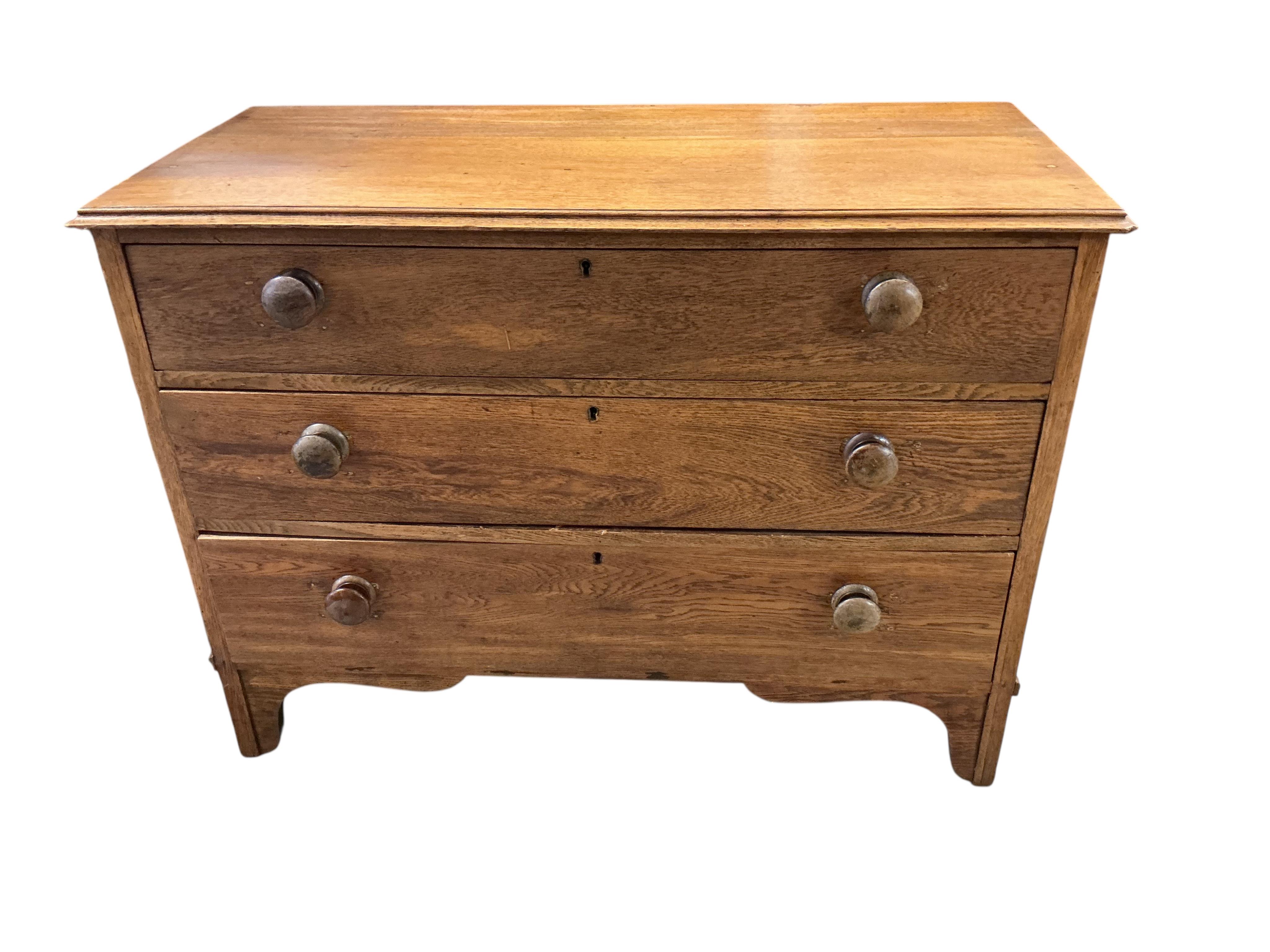 An early 20th century oak three drawer chest, width 106cm, depth 49cm, height 78cm